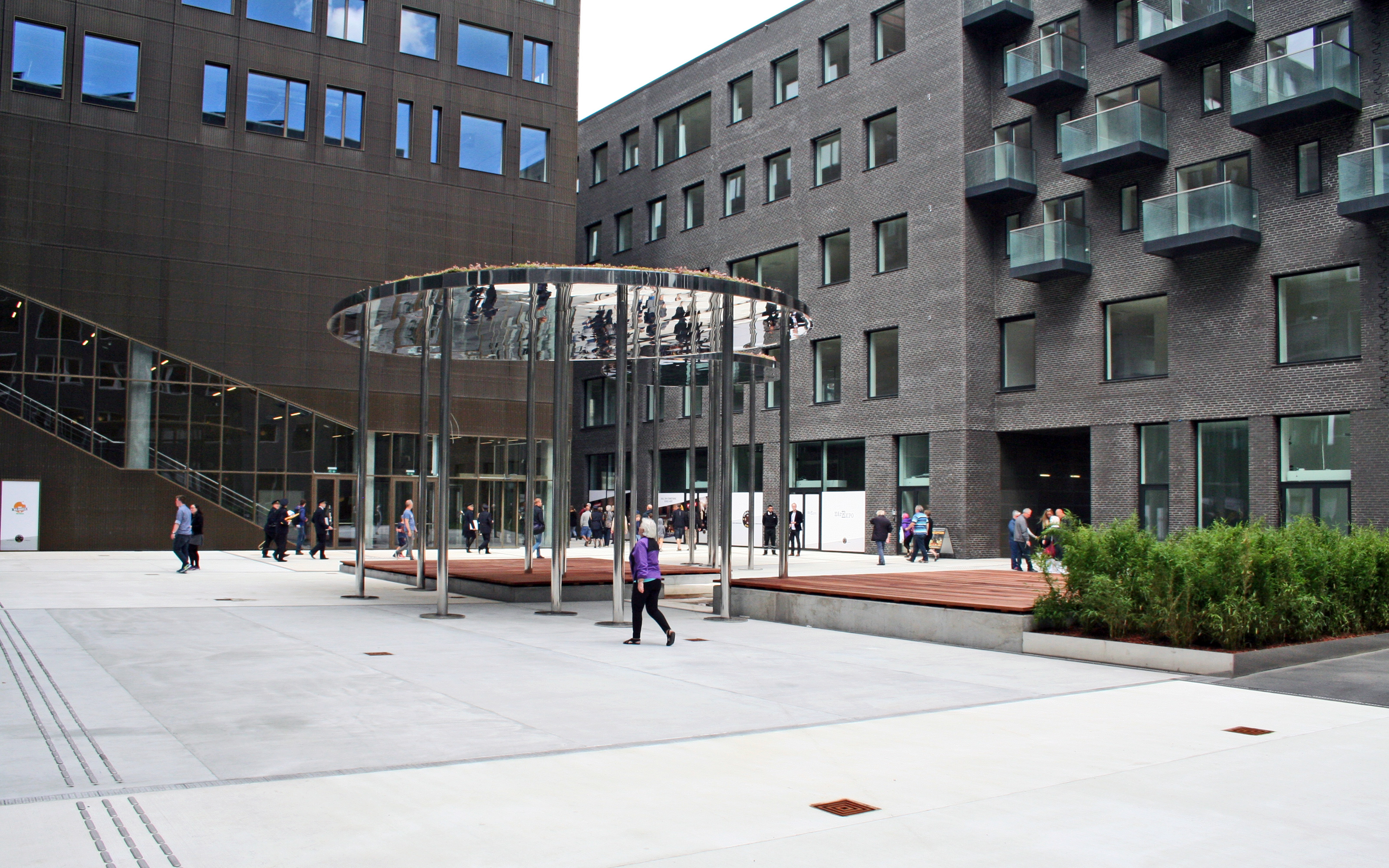 Courtyard with plant beds and sitting areas on wooden decks